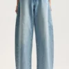 Pantalón holgado con logotipo brillante