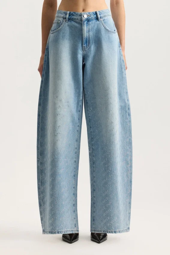 Pantalón holgado con logotipo brillante