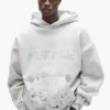 Sudadera con capucha de camuflaje con tachuelas
